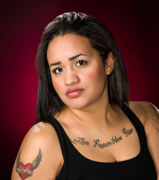 Professional portrait of woman with tattoos